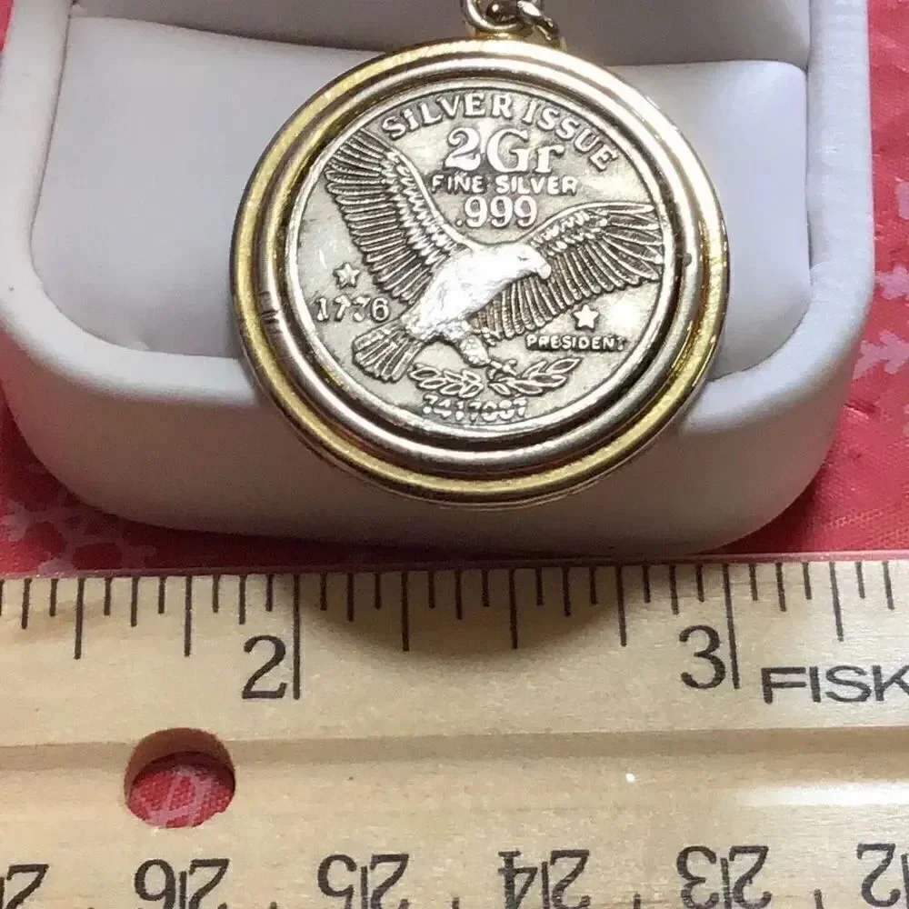 Vintage two gram silver issue 999 Eagle pendant